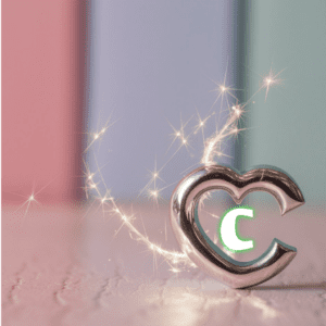 Shimmering silver 'C' in the bottom right corner of a heart, perfect for a sophisticated name DP."