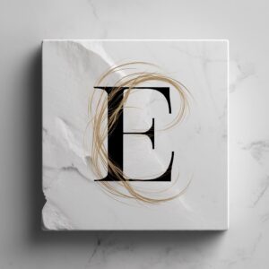 The letter E engraved in white marble with elegant gold accents, designed with minimalist aesthetics."