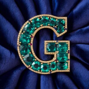 Green gemstone "G" with gold borders and jewel accents, ideal for a regal name DP design.