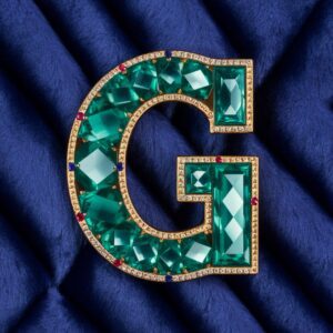 Emerald gemstone "G" with gold and sapphire accents, perfect for a royal-themed name DP.