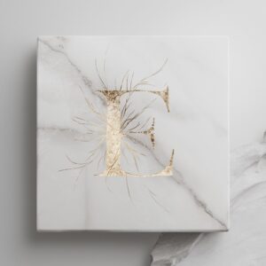 White marble letter E with clean gold streaks, focusing on minimalist and elegant design."