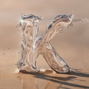 Fluid 3D 'K' design with water droplets, ideal for a serene, beach-inspired name DP."