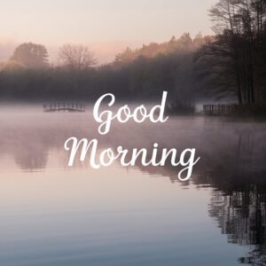 A serene lakeside scene with gentle mist and an inspiring morning message