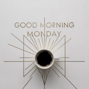 Minimalist design featuring geometric gold lines and modern text: 'Good Morning Monday'."