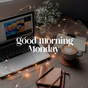 Elegant desk setup featuring heart-shaped cappuccino foam, great for a productive Monday.